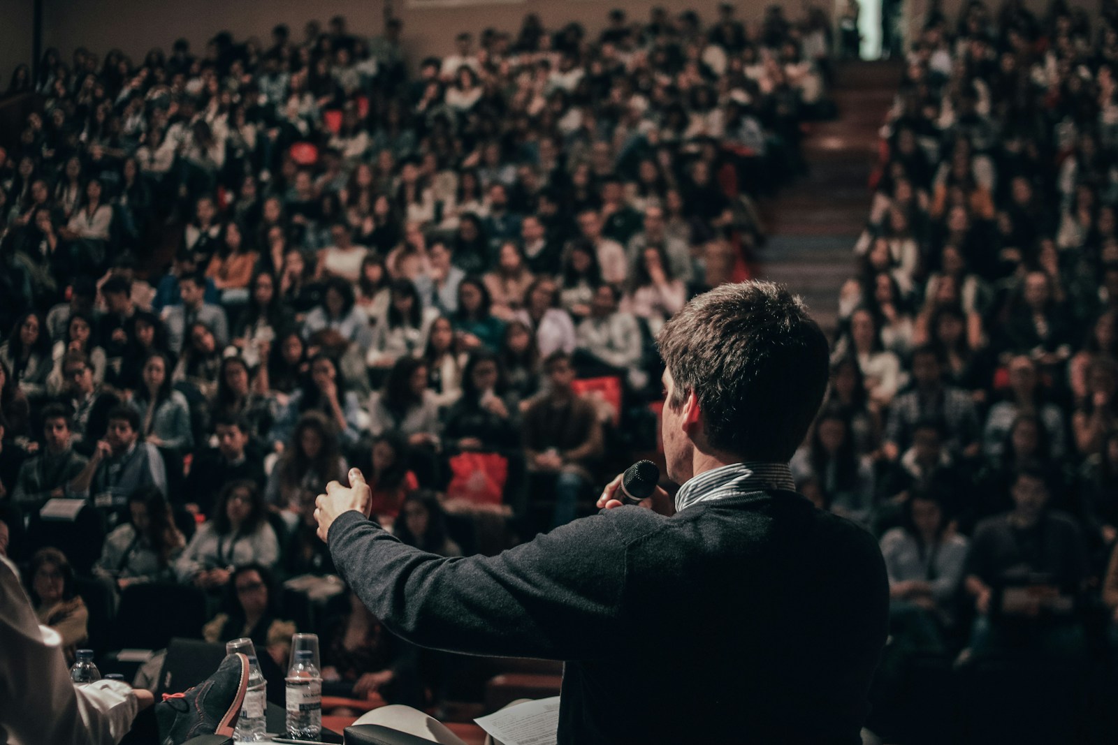 Illustrative photograph of an academic audience sharing ideas at a gathering