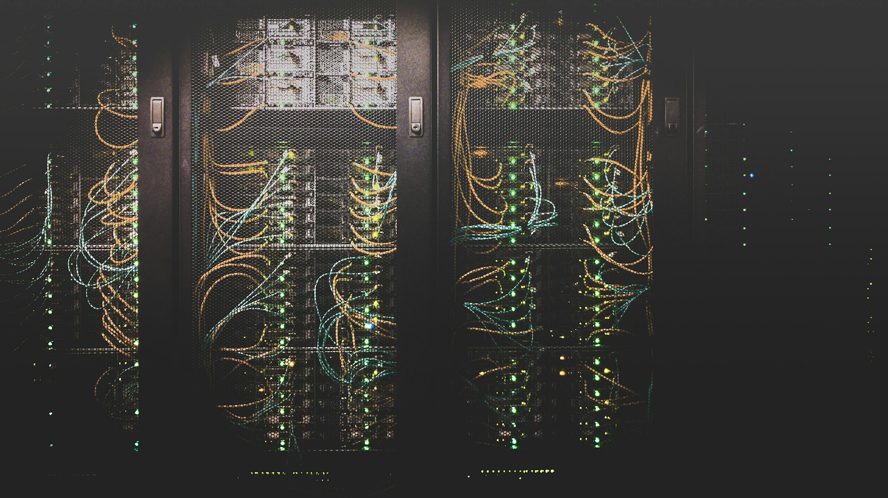 Illustrative photograph of server racks in a computing facility